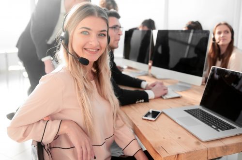close up. young call center consultant sitting at his Desk